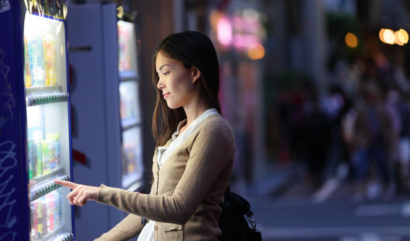 Buying A Drink From A Vending Machine In Japan